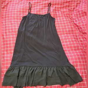 Black dress with ruffle bottom. Size L.